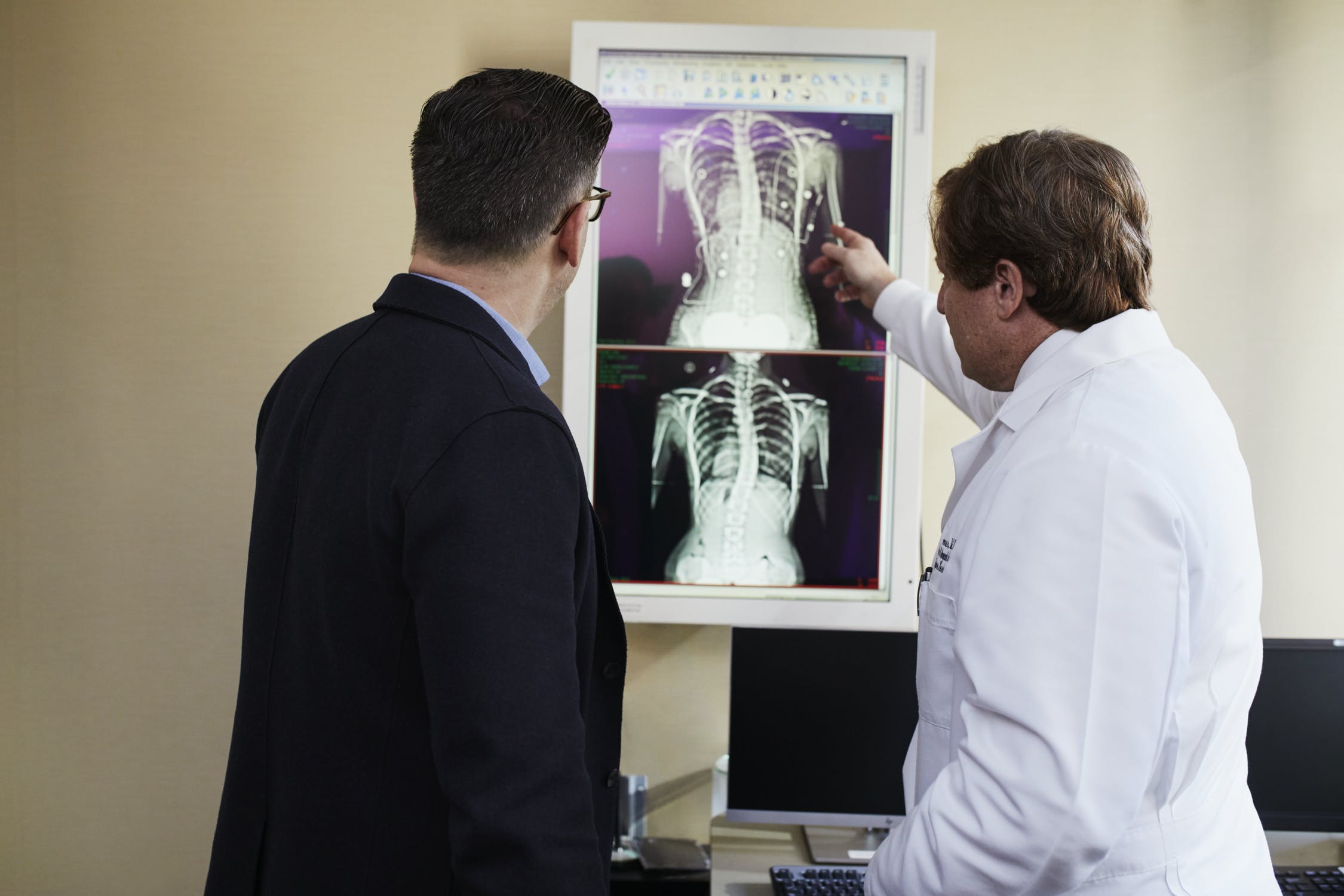 doctor and patient looking at x rays